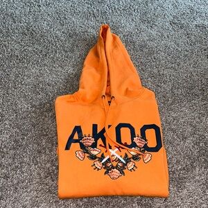 Large Men’s AKOO hooded sweatshirt orange.